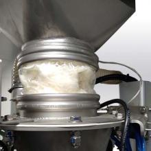 A BFM® fitting sleeve is a flexible connector used to join two pieces of equipment in powder processing systems.