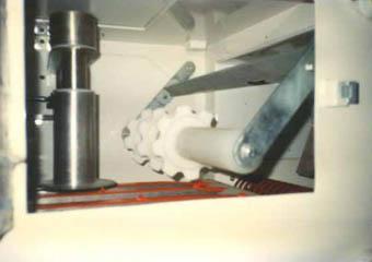 Vide sacs automatique avec rouleau de maintien